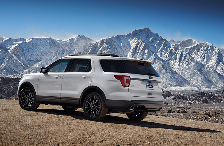 2017 Ford Explorer parked near snowy mountains 