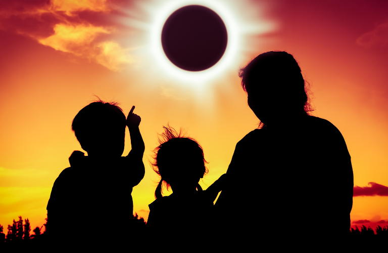 A family looking at Solar eclipse