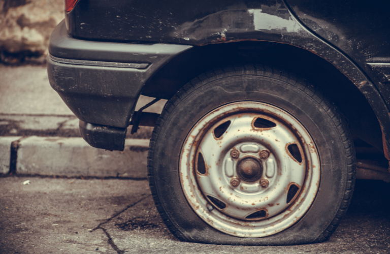 A close up of a flat tire