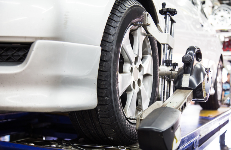 A vehicle being inspected at a dealership