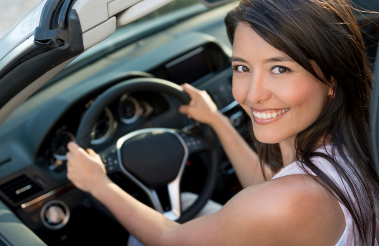 A woman driving a vehicle 