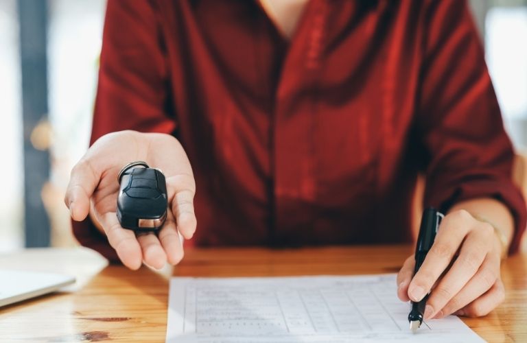 Person holding a car key